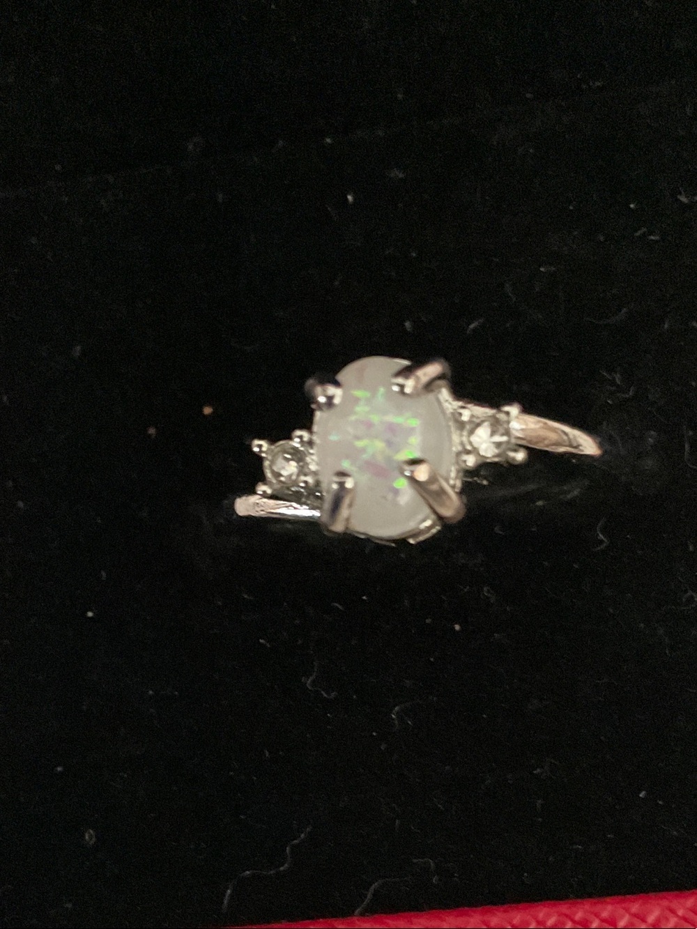 ELEGANT WHITE OPAL RING, SIDE ZIRCONIA CHIPS ON A SILVER PLATED BAND- SIZE 7